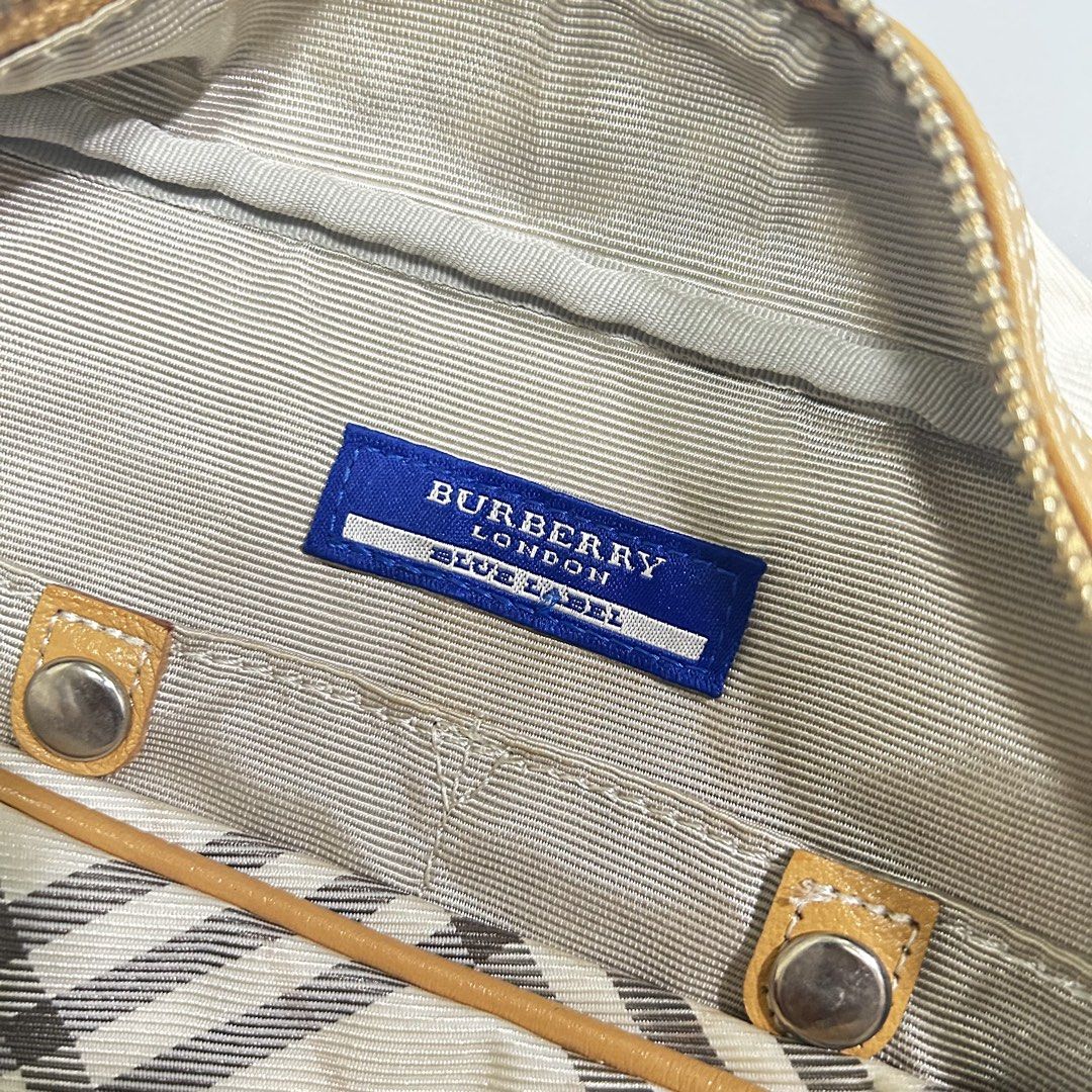 Burberry Blue Label Boston Bag (Category: Luxury Bags & Wallets) located in Pandi. Submitted by davidsorianooo917 (Listing ID 1465898386, Image 3). Description: Burberry Blue Label Boston Bag Actual Width: 13 Actual Length: 7 Classic Burberry Nova Check pattern Tan leather trims & handles Spacious Boston-style design Actual photos posted .