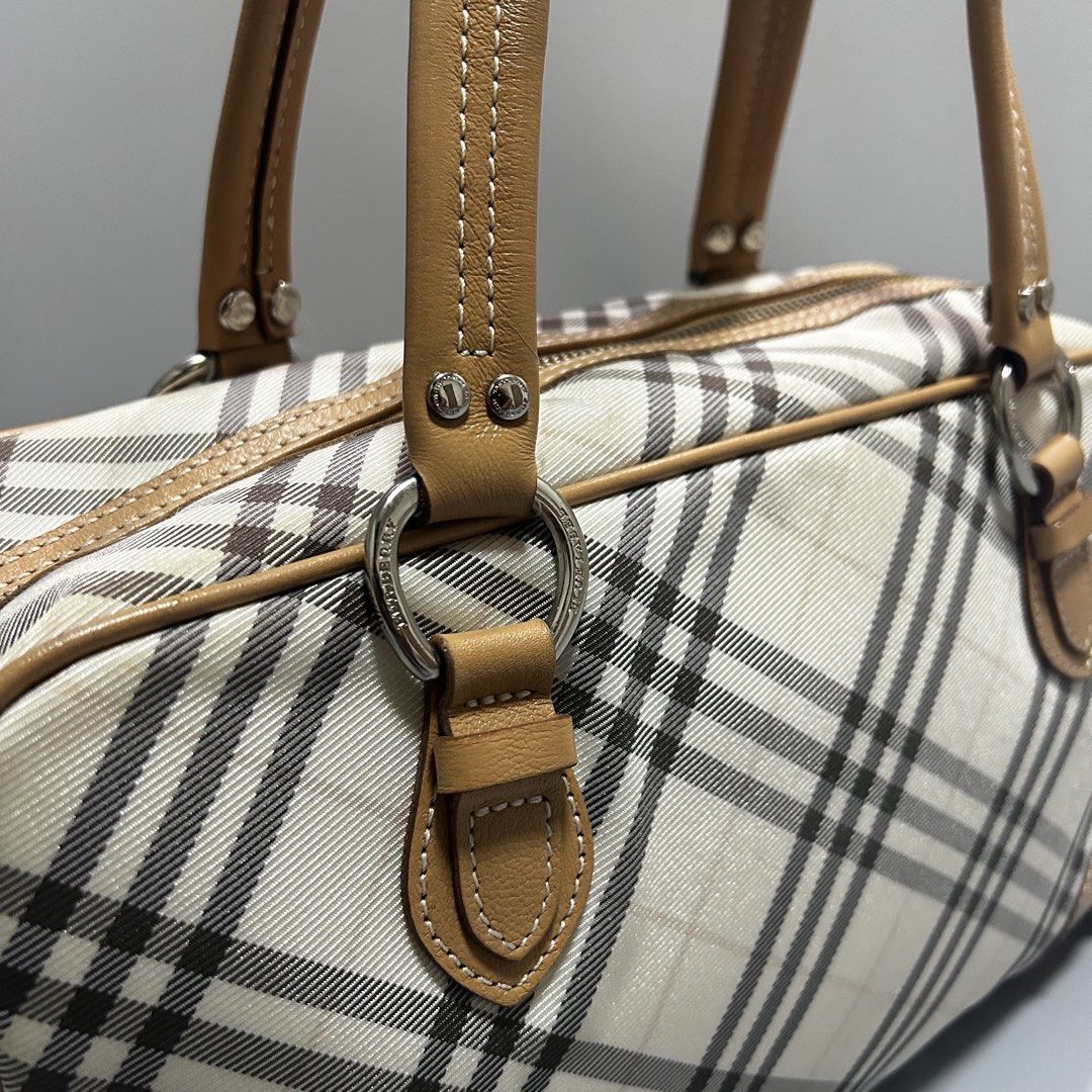 Burberry Blue Label Boston Bag (Category: Luxury Bags & Wallets) located in Pandi. Submitted by davidsorianooo917 (Listing ID 1465898386, Image 2). Description: Burberry Blue Label Boston Bag Actual Width: 13 Actual Length: 7 Classic Burberry Nova Check pattern Tan leather trims & handles Spacious Boston-style design Actual photos posted .