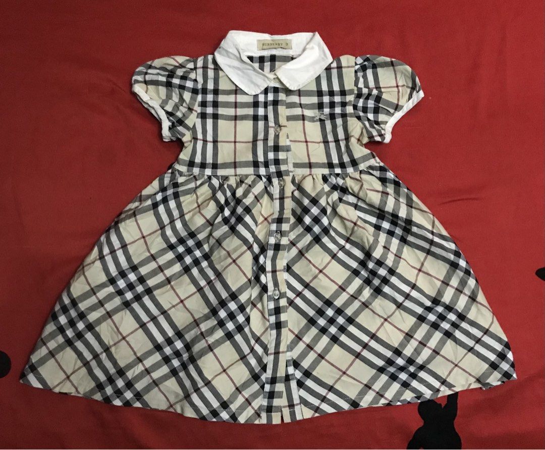 Burberry Dress (Category: Babies & Kids Fashion) located in Angeles City. Submitted by bashthriftstuff123 (Listing ID 1465787981, Image 1). Description: Burberry Dress Size 3 Width 11.5 Length 20.5 Like new condi 460 + sf.