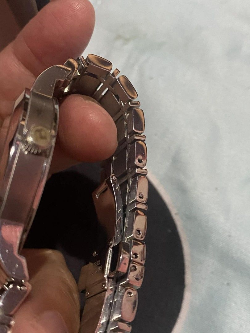 Burberry silver analog watch with date display (Category: Women's Watches) located in Manila. Submitted by goodbuying_items0211 (Listing ID 1465776109, Image 2). Description: - Authentic Burberry silver-tone analog watch - Iconic textured check pattern dial with a 3 o'clock date window - Durable stainless steel linked bracelet with a secure deployment clasp - Swiss made movement for reliable timekeeping - Fully functional and well-kept condition 