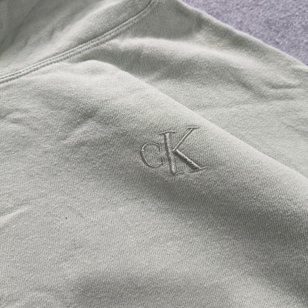 Calvin Klein Hoodie (Category: Activewear) located in Manila. Submitted by shykes_26 (Listing ID 1465760154, Image 2). Description: Dimensions Width - 26 Length - 24 Size on tag - L Issues - None.