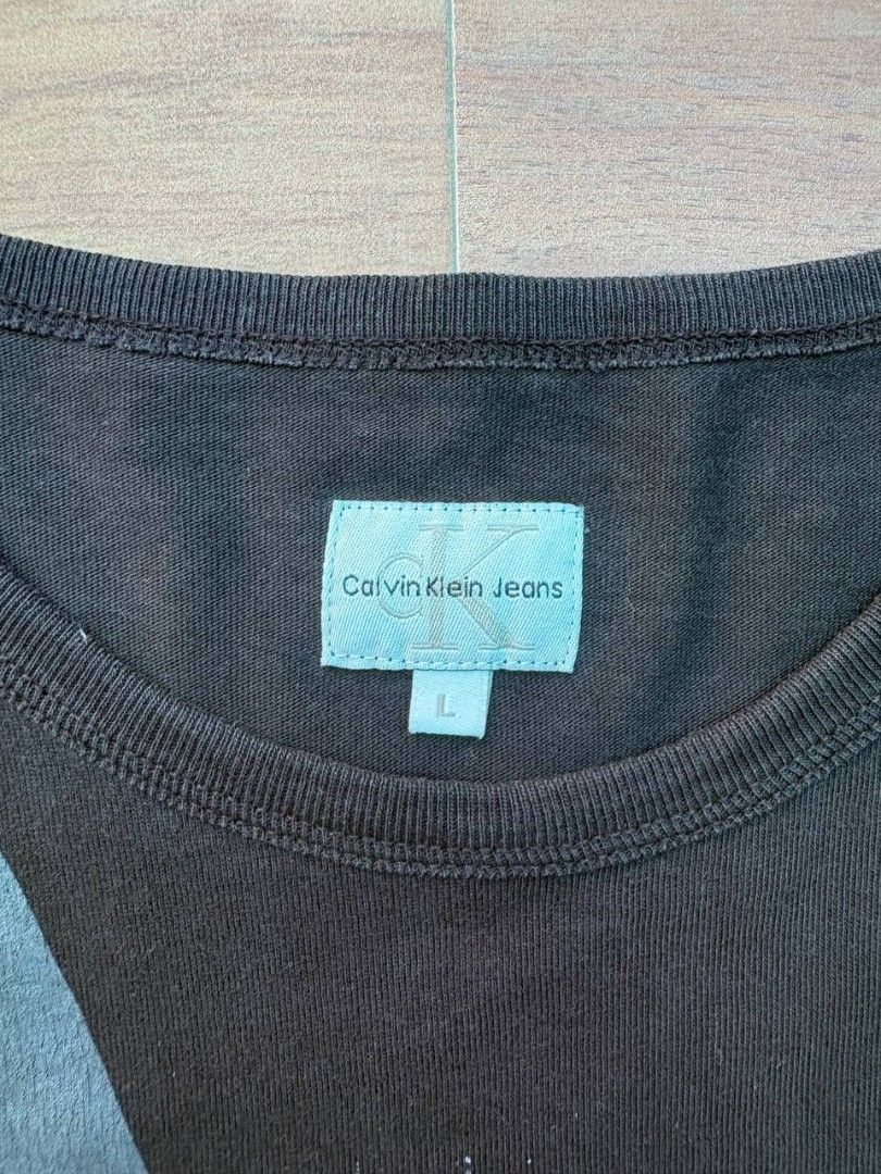 CALVIN KLEIN JEANS GRAPHIC TEE (Category: Tshirts & Polo Shirts ) located in Tacurong. Submitted by ukayutopia (Listing ID 1465871762, Image 3). Description: Dimes: W21×L27 Condition: 9/10 Size on tag: Large Issue: None ‎.