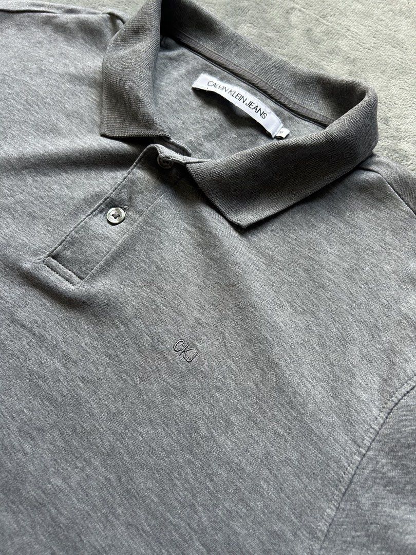Calvin Klein Jeans Polo Shirt (Category: Tshirts & Polo Shirts ) located in Manila. Submitted by wenttttt (Listing ID 1465944875, Image 2). Description: 20 x 27 Issue : cut washtag.