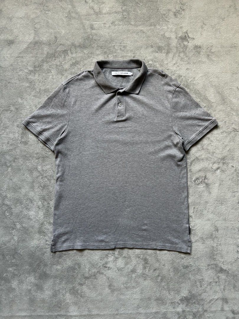 Calvin Klein Jeans Polo Shirt (Category: Tshirts & Polo Shirts ) located in Manila. Submitted by wenttttt (Listing ID 1465944875, Image 1). Description: 20 x 27 Issue : cut washtag.