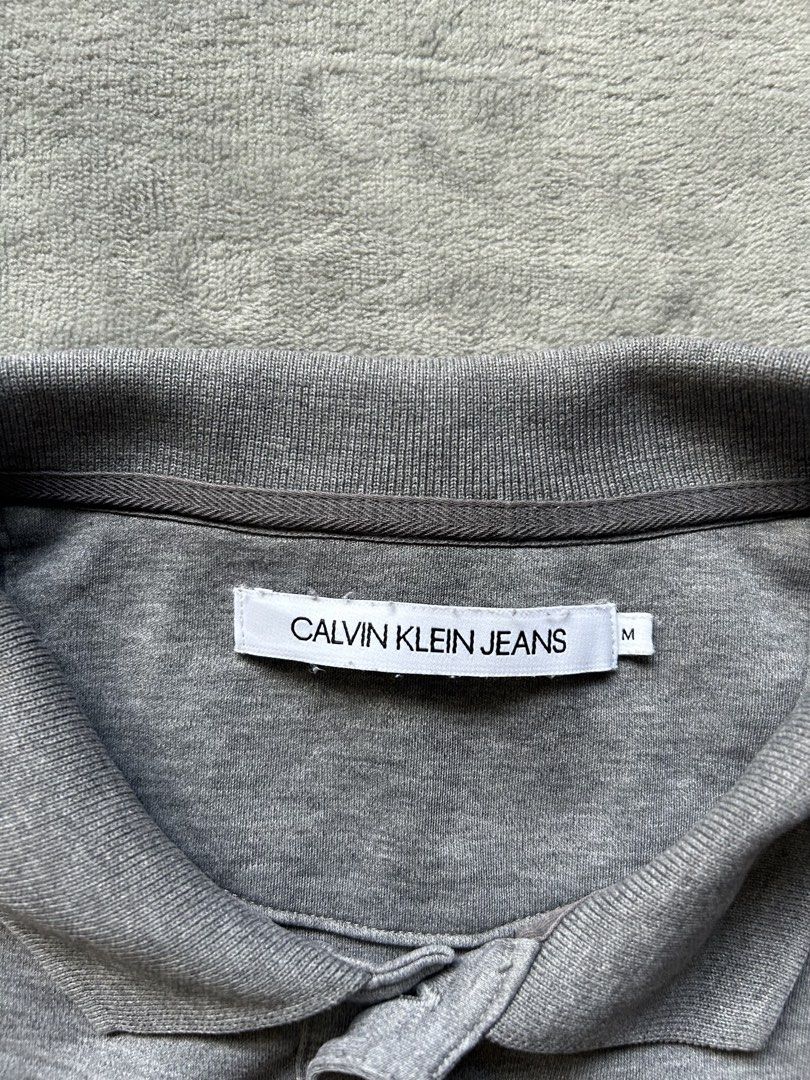Calvin Klein Jeans Polo Shirt (Category: Tshirts & Polo Shirts ) located in Manila. Submitted by wenttttt (Listing ID 1465944875, Image 3). Description: 20 x 27 Issue : cut washtag.