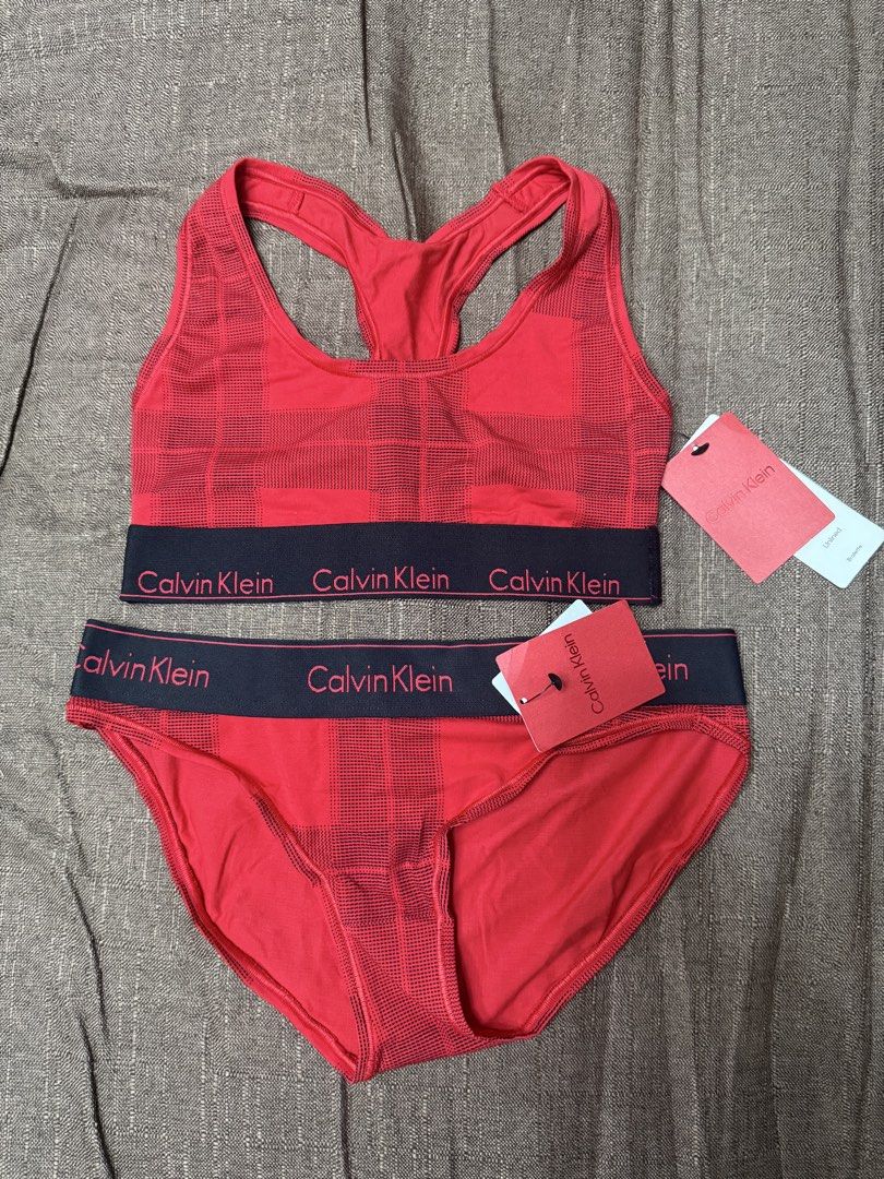 Calvin Klein Red Plaid Bralette and Bikini Set (Category: Undergarments & Loungewear) located in Quezon City. Submitted by mt031199 (Listing ID 1465946851, Image 1). Description: - Brand new with original retail tags attached - Matching set includes unlined racerback bralette and bikini bottoms - Features signature Calvin Klein logo elastic waistband in dark navy blue - Crafted from soft stretch fabric with a bold red plaid checkered print - Auth