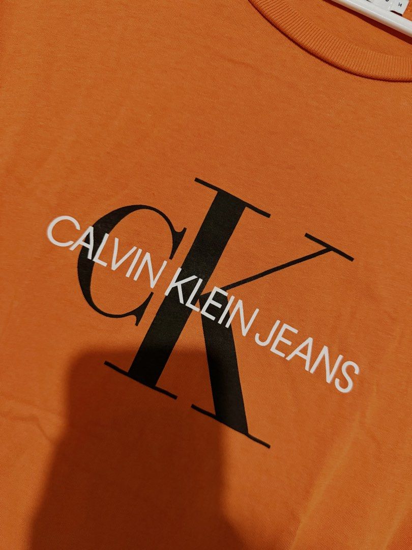 Calvin Klein orange shirt (Category: Shirts) located in Rizal. Submitted by lmbelle (Listing ID 1465940513, Image 2). Description: .