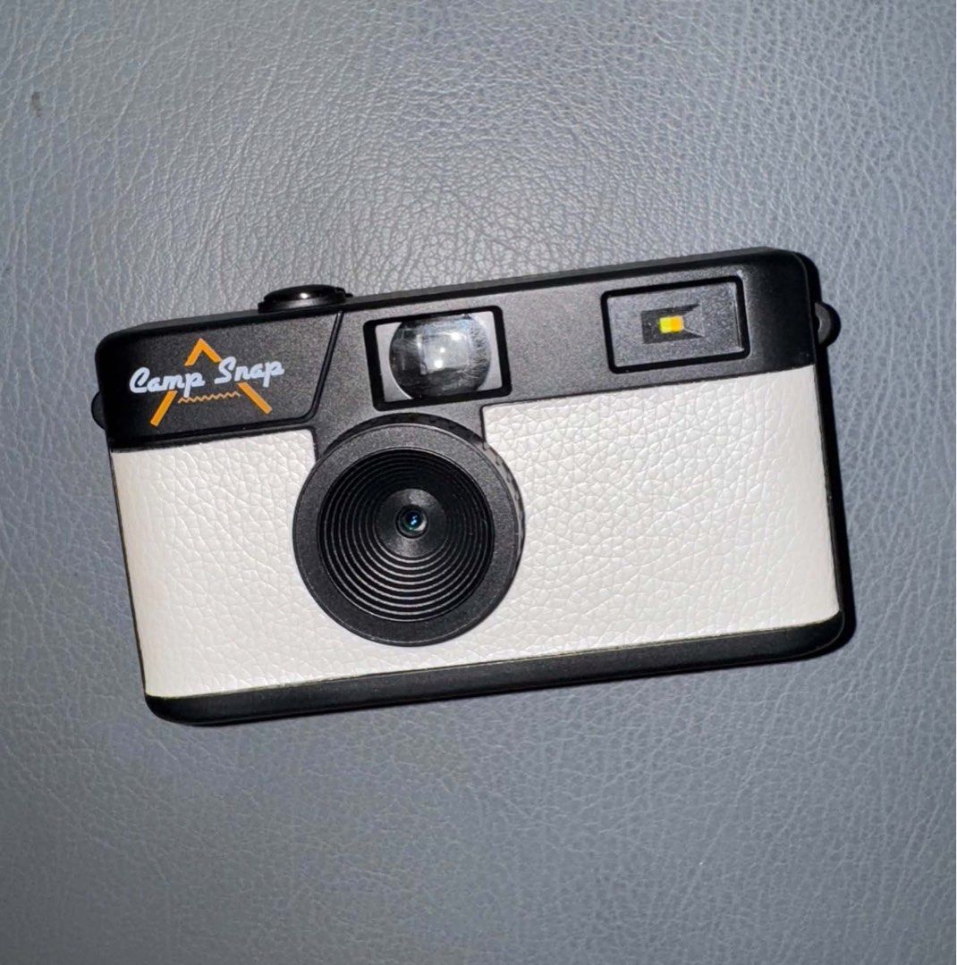 Camp Snap Camera 103B (Category: Cameras) located in Mandaluyong City. Submitted by helloakiii (Listing ID 1465900315, Image 1). Description: Camp Snap digital camera with a white textured body and black accents. Vintage point-and-shoot look without the screen. Fun device for trips, hikes, and everyday street photography. Lightweight build, easy to slip into your pocket. Price is slightly negotiable. Used once only during our taiwan trip. Rfs: go