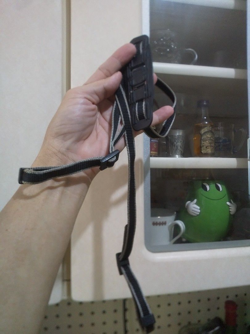 Canon Camera Strap Black Grey Adjustable (Category: Camera Bags & Carriers) located in Binan City. Submitted by rpute (Listing ID 1465847739, Image 1). Description: - 100% Original Canon camera neck strap - Stylish black and grey striped woven nylon - Textured rubber shoulder pad for all-day shooting comfort - Adjustable plastic buckles with embossed Canon logo - Standard strap ends for easy attachment to camera eyelets - Ideal as a reliable back