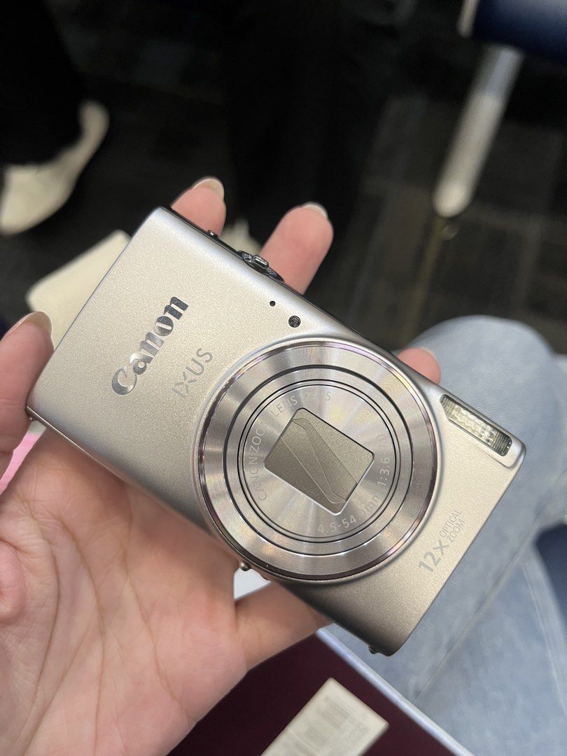 Canon IXUS 285 HS A Silver Digital Camera (Category: Cameras) located in Quezon City. Submitted by angelenergy (Listing ID 1465923719, Image 1). Description: Barely used No issue Still with box Has screen protector Bought from Henry's Camera Photo - MAY 2026.