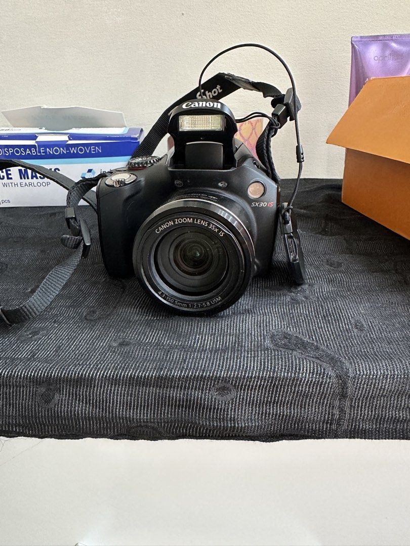 Canon PowerShot SX30 IS Digital Camera (Category: Cameras) located in Manila. Submitted by dihlicious (Listing ID 1465806361, Image 1). Description: - Canon PowerShot SX30 IS bridge camera - 35x optical zoom lens from 4.3 to 150.5mm. - Used like new - Comes with 2 camera batteries, battery charger, and a camera bag.