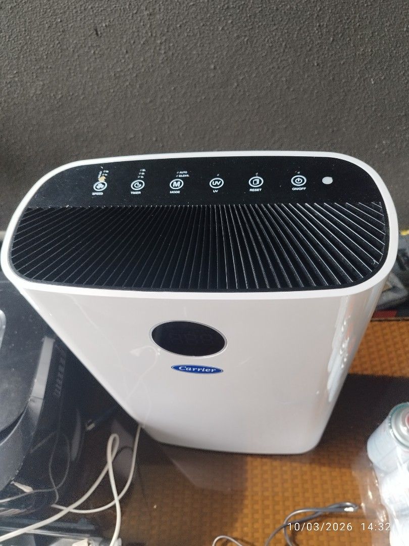 Carrier Air Purifier with Remote Control (Category: Air Purifiers & Dehumidifiers) located in Cebu City. Submitted by jlorana11395954 (Listing ID 1465898048, Image 2). Description: - Brand: Carrier Air Purifier - Color: Clean White - Features: Digital display screen, multiple control buttons (speed, timer, mode, UV, reset) - Design: Top air vent grill, sleek exterior housing - Inclusion: Original remote control included - Condition: Excellent, cl