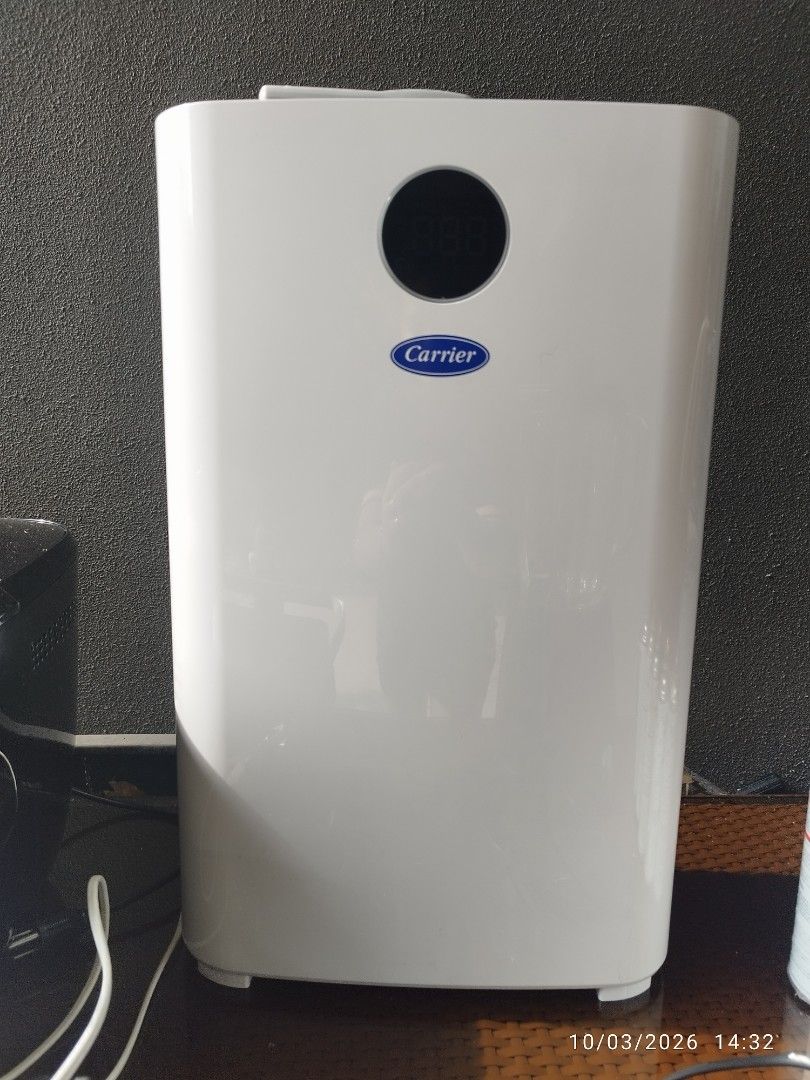 Carrier Air Purifier with Remote Control (Category: Air Purifiers & Dehumidifiers) located in Cebu City. Submitted by jlorana11395954 (Listing ID 1465898048, Image 1). Description: - Brand: Carrier Air Purifier - Color: Clean White - Features: Digital display screen, multiple control buttons (speed, timer, mode, UV, reset) - Design: Top air vent grill, sleek exterior housing - Inclusion: Original remote control included - Condition: Excellent, cl