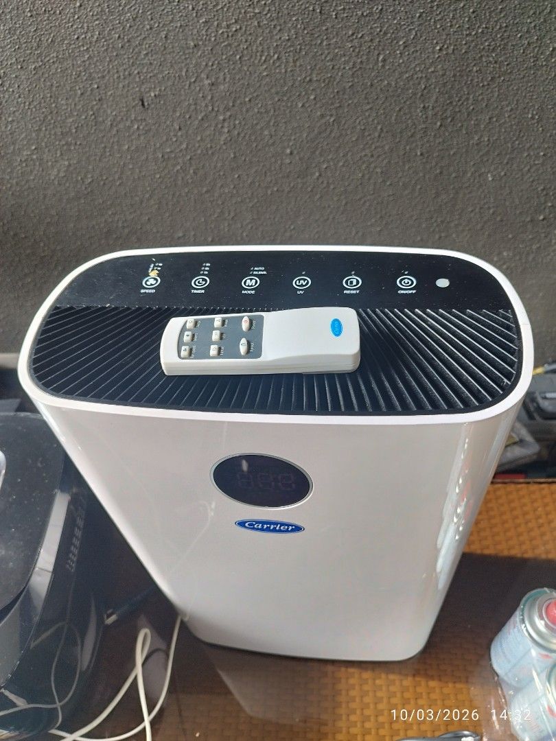 Carrier Air Purifier with Remote Control (Category: Air Purifiers & Dehumidifiers) located in Cebu City. Submitted by jlorana11395954 (Listing ID 1465898048, Image 3). Description: - Brand: Carrier Air Purifier - Color: Clean White - Features: Digital display screen, multiple control buttons (speed, timer, mode, UV, reset) - Design: Top air vent grill, sleek exterior housing - Inclusion: Original remote control included - Condition: Excellent, cl