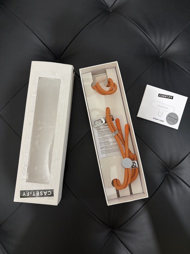 CASETiFY Rope Cross-body Strap 6mm Orange (Category: Cross-body Bags) located in Cavite. Submitted by sarah_margaret7 (Listing ID 1465929729, Image 1). Description: - Brand: CASETiFY - Color: Vibrant Orange - Thickness: 6mm rope design - Features: Adjustable length with durable metal hardware and toggle adjuster - Inclusions: Strap card with grey/silver ring attachment and original box packaging - Condition: Brand new / Excellent, ready to use - 