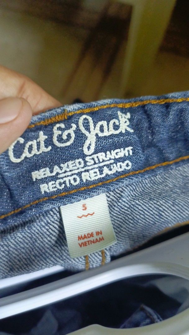 Cat & Jack Relaxed Straight Jeans Size 5 (Category: Babies & Kids Fashion) located in Paranaque City. Submitted by rchllrms (Listing ID 1465852385, Image 2). Description: - Brand: Cat & Jack - Size: 5 - Style: Relaxed straight fit, dark wash denim - Details: Contrast stitching, front and back pockets, small distressed rip on the right knee - Origin: Made in Vietnam.