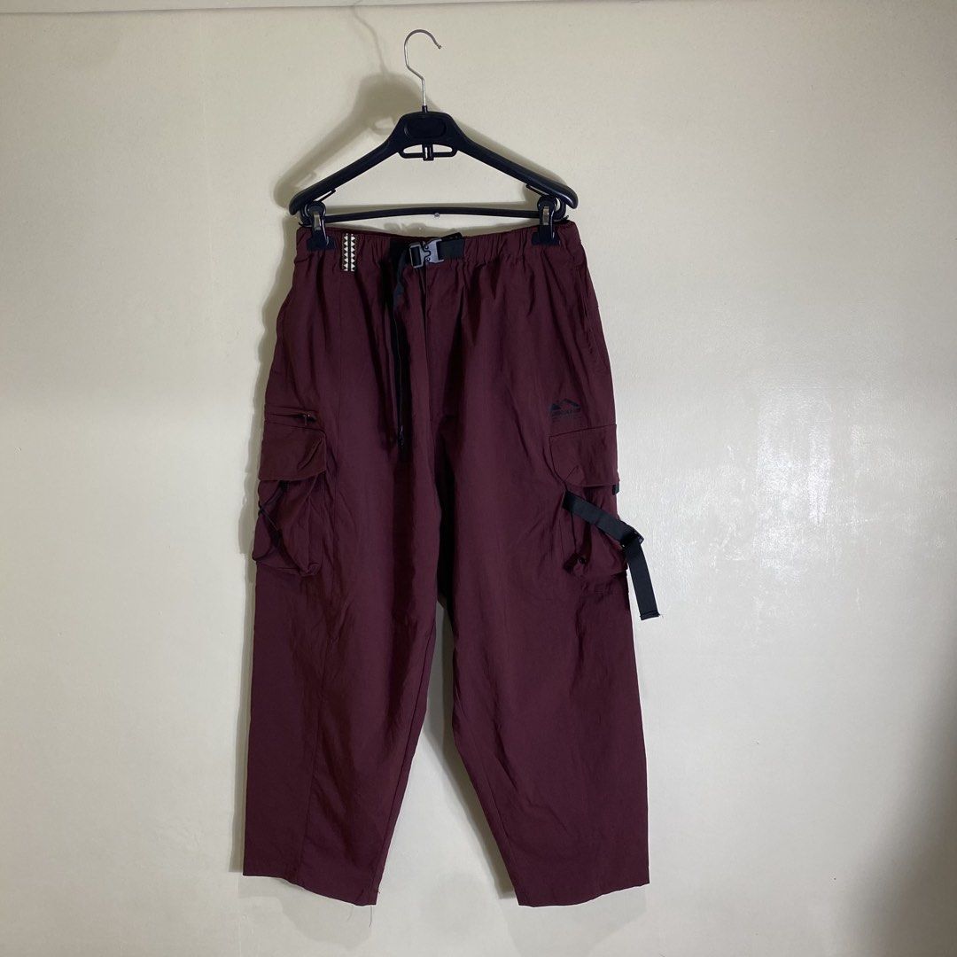 Catalog Maroon Cargo Pants Size M (Category: Chinos) located in Cebu City. Submitted by theloose.thread (Listing ID 1465919526, Image 1). Description: - Brand: Catalog - Color: Maroon - Size: M (Corresponds to 175/80A) - Material: 95% nylon, 5% elastane (lightweight technical fabric) - Waistband: Elastic with integrated buckle belt - Pockets: Side pockets with adjustable straps - Care: Machine wash cold - Best for: Casual or outdoor wear.