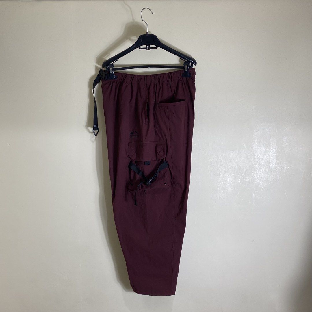 Catalog Maroon Cargo Pants Size M (Category: Chinos) located in Cebu City. Submitted by theloose.thread (Listing ID 1465919526, Image 2). Description: - Brand: Catalog - Color: Maroon - Size: M (Corresponds to 175/80A) - Material: 95% nylon, 5% elastane (lightweight technical fabric) - Waistband: Elastic with integrated buckle belt - Pockets: Side pockets with adjustable straps - Care: Machine wash cold - Best for: Casual or outdoor wear.