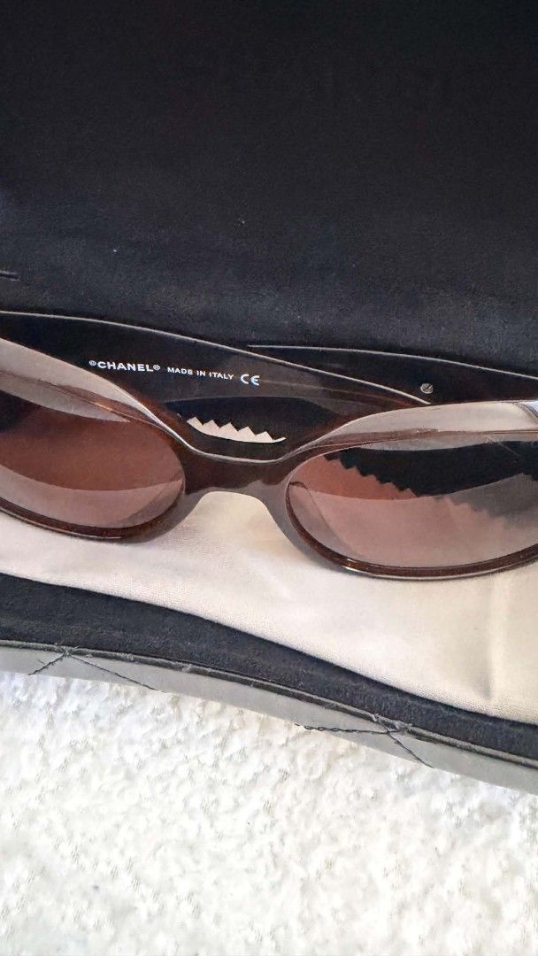 Chanel 5113 Camellia Tortoise Sunglasses with Case (Category: Sunglasses & Eyewear) located in Manila. Submitted by whemc (Listing ID 1465802906, Image 2). Description: - 100% Authentic Chanel sunglasses (Model: 5113, Color Code: c.538/73) - Classic tortoise shell frame with stylish gradient brown lenses - Features iconic CC logo and elegant camellia flower accents on the arms - Size: 56-16-130 | Made in Italy - Inclusions: Comes with original qu