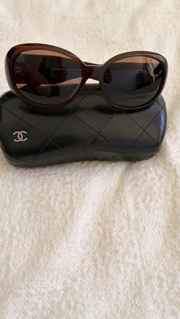 Chanel 5113 Camellia Tortoise Sunglasses with Case (Category: Sunglasses & Eyewear) located in Manila. Submitted by whemc (Listing ID 1465802906, Image 1). Description: - 100% Authentic Chanel sunglasses (Model: 5113, Color Code: c.538/73) - Classic tortoise shell frame with stylish gradient brown lenses - Features iconic CC logo and elegant camellia flower accents on the arms - Size: 56-16-130 | Made in Italy - Inclusions: Comes with original qu
