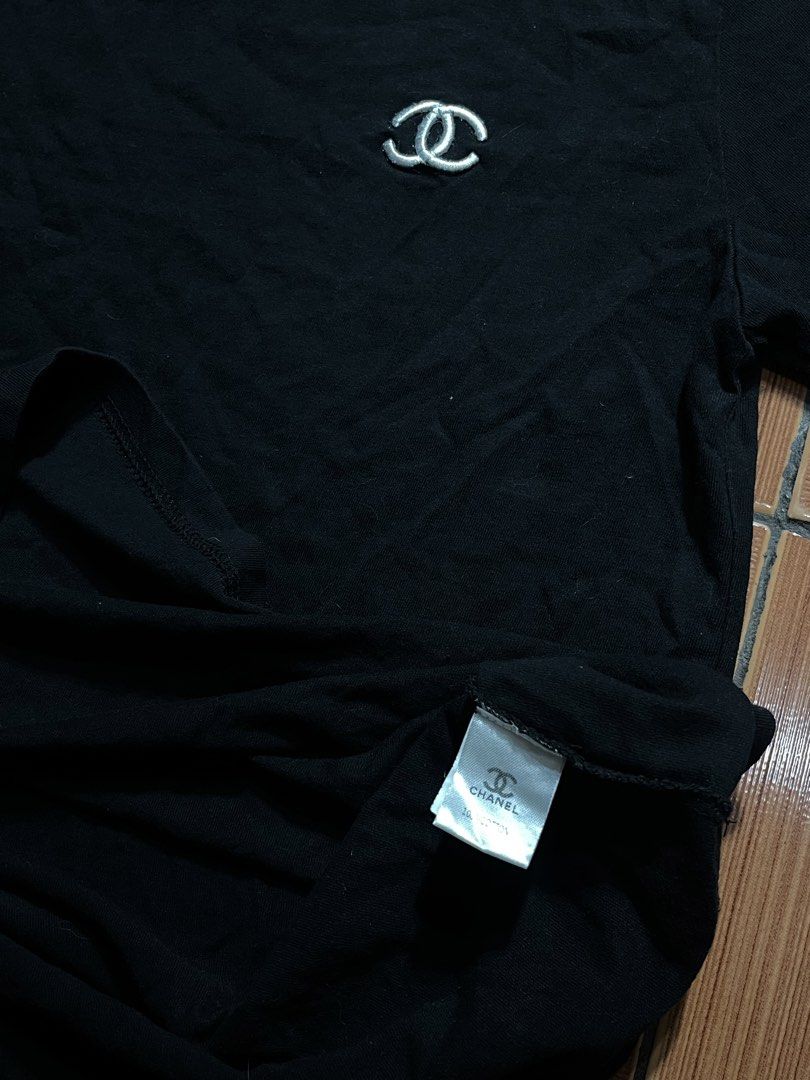 Chanel Black T-shirt with CC Logo (Category: Shirts) located in Manila. Submitted by cycy16_2004 (Listing ID 1465765518, Image 2). Description: - Brand: Chanel - Color: Black - Material: Premium cotton - Size: Small - Classic embroidered CC logo on the chest - Features branded inner collar tag and "CHANEL" box patch on the right sleeve - Includes original size tag near the neckline and bottom hem label - Condition: Brand new / Excellent (Ready to