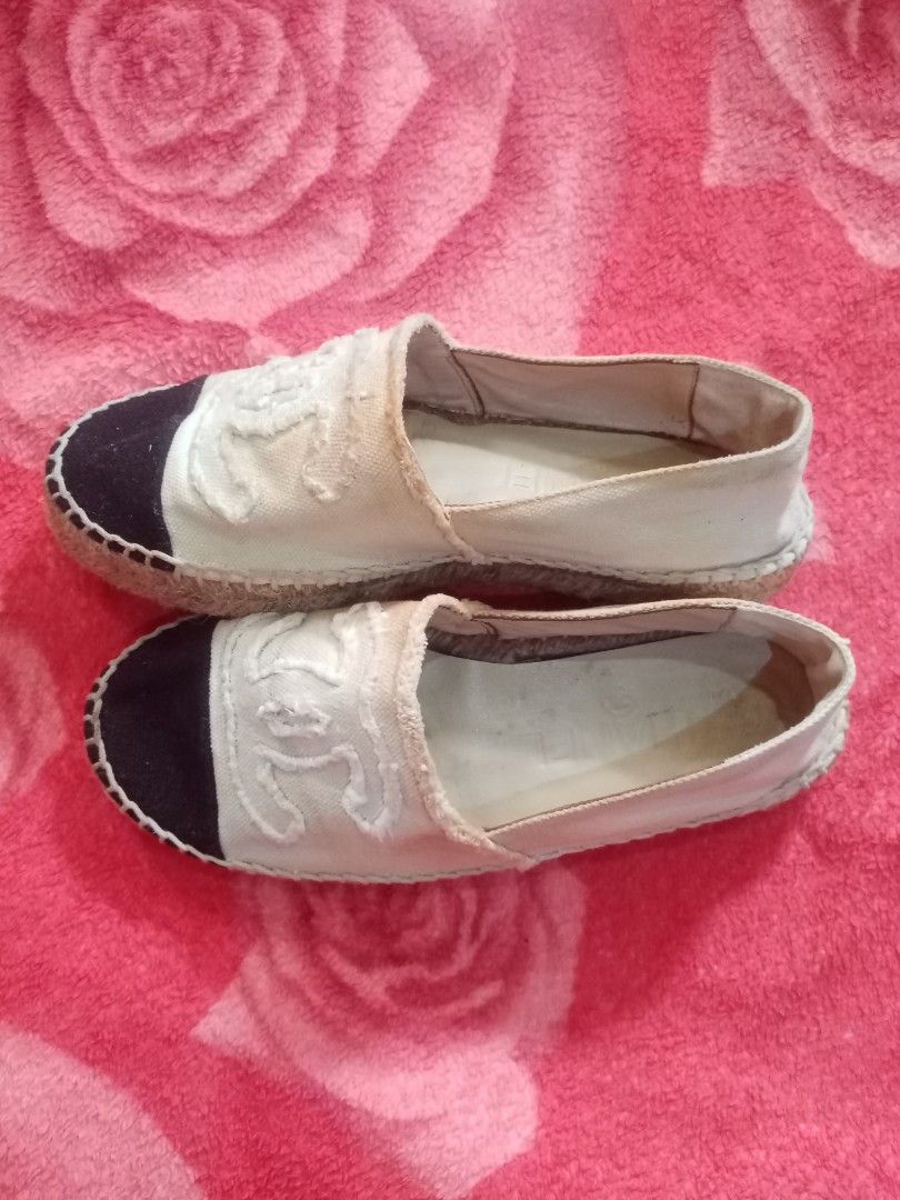Chanel Canvas CC Espadrilles (Category: Sneakers & Footwear) located in Danao, Cebu. Submitted by althethrifter (Listing ID 1465796619, Image 2). Description: - Authentic Chanel espadrilles in white canvas with black toe caps - Features iconic large stitched CC logo on the front - Classic jute midsole trim and diamond-quilted rubber outsoles - Pre-owned condition with interior dirt and discoloration - Shows yellowish staining around the collar an