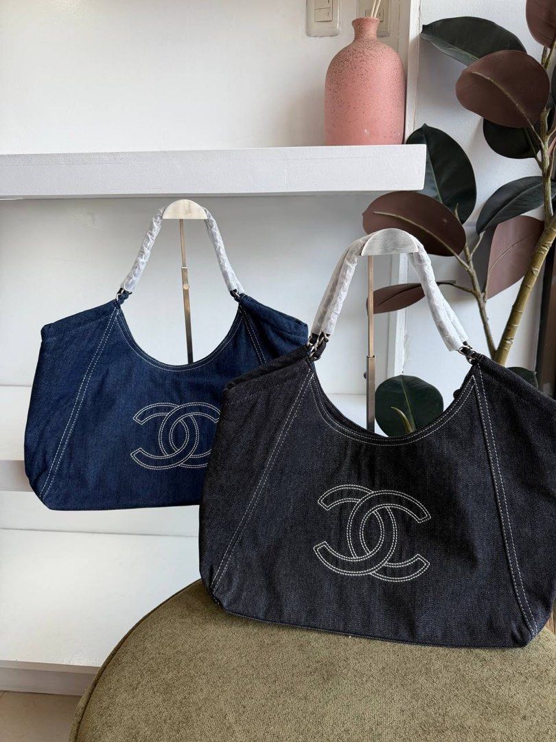Chanel Denim Tote Bag (Category: Shoulder Bags) located in Manila. Submitted by nicolebendz (Listing ID 1465900395, Image 1). Description: Trendy alert 🔔 👀 CHANEL DENIM TOTE BAG ₱ 2,050 + SF —— • —— • Top Premium Quality (grabe quality and 3k bentahan online) • Ready to ship via J&T (2-3 days) **Actual pictures - Style: Denim Hobo Bag (Dark wash and black denim) - Details: Large white stitched interlocking CC logo, contrasting white topstitchin