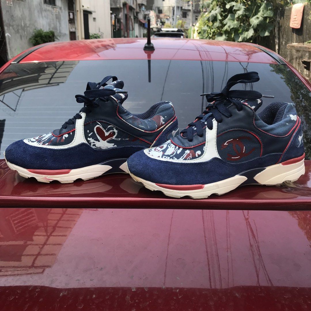 CHANEL💕 (IG26582 CC Logo Sneakers)! (Category: Sneakers & Footwear) located in Bulacan. Submitted by xxboutique2428 (Listing ID 1465835725, Image 2). Description: CHANEL IG26582 CC Logo Sneakers Condition: Pre-Owned / Used With Care Size: EU 39 Style Code: IG26582 Color: Navy Blue / Red / White Style: Low-top fashion sneakers Design: Interlocking CC logo with multicolor detailing Closure: Lace-up Material: Suede/leather/textile construction.