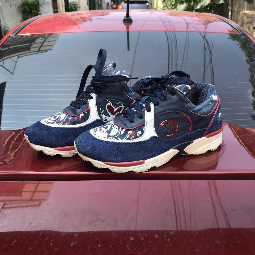CHANEL💕 (IG26582 CC Logo Sneakers)! (Category: Sneakers & Footwear) located in Bulacan. Submitted by xxboutique2428 (Listing ID 1465835725, Image 1). Description: CHANEL IG26582 CC Logo Sneakers Condition: Pre-Owned / Used With Care Size: EU 39 Style Code: IG26582 Color: Navy Blue / Red / White Style: Low-top fashion sneakers Design: Interlocking CC logo with multicolor detailing Closure: Lace-up Material: Suede/leather/textile construction.