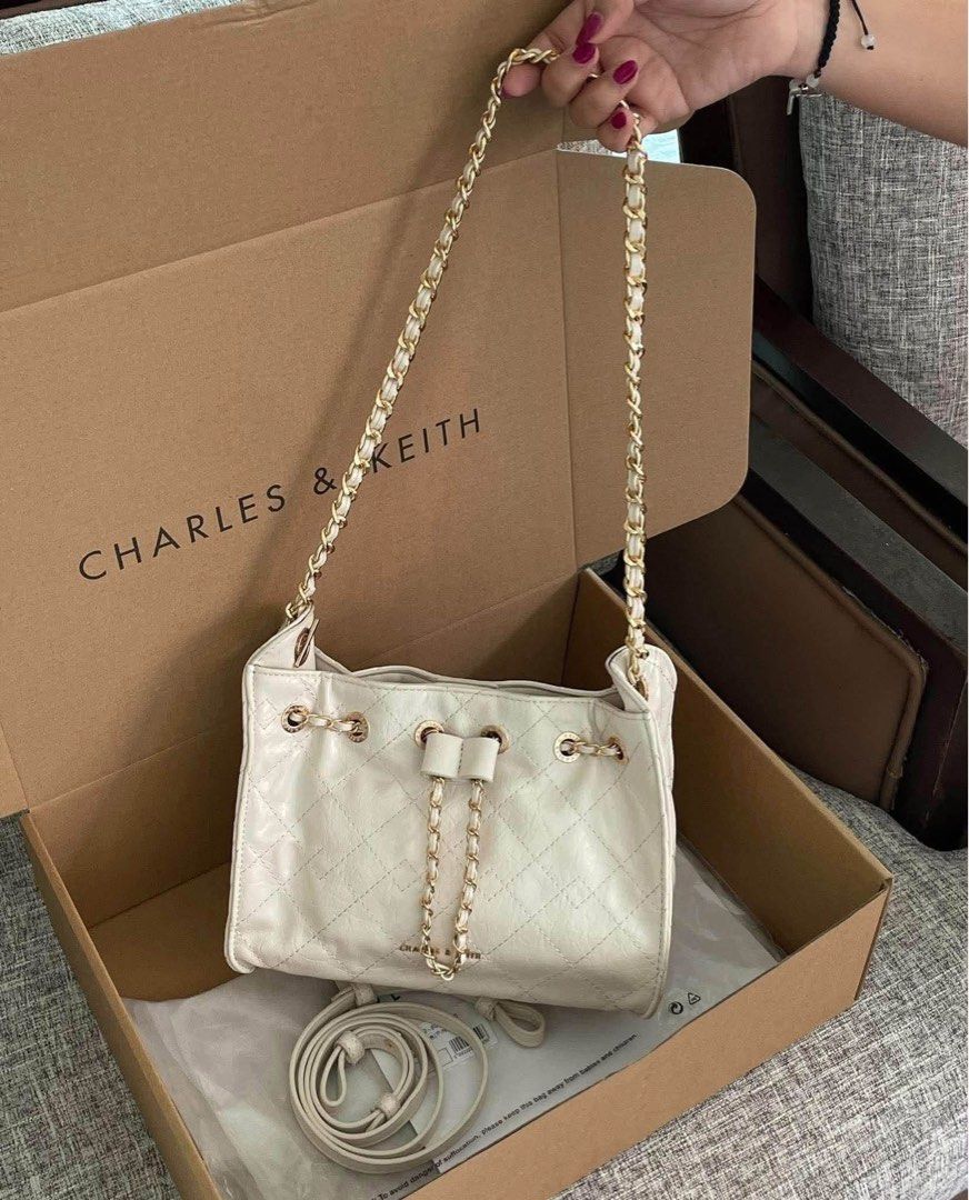Charles & Keith Duo Drawstring Bag (Category: Shoulder Bags) located in Pasig City. Submitted by 3dsbagcollectionbydiane (Listing ID 1465858473, Image 2). Description: ONHAND and Ready to Ship ✨ ₱1050 Add ₱80 for Paper Bag MOD: Lalamove, Grab, Angkas Padala, etc. 🎀TrieeDeesCollection for proof of deliveries/transactions and other available items. PM for more questions. Thank you! 🤍 📍Pasig/Manila.