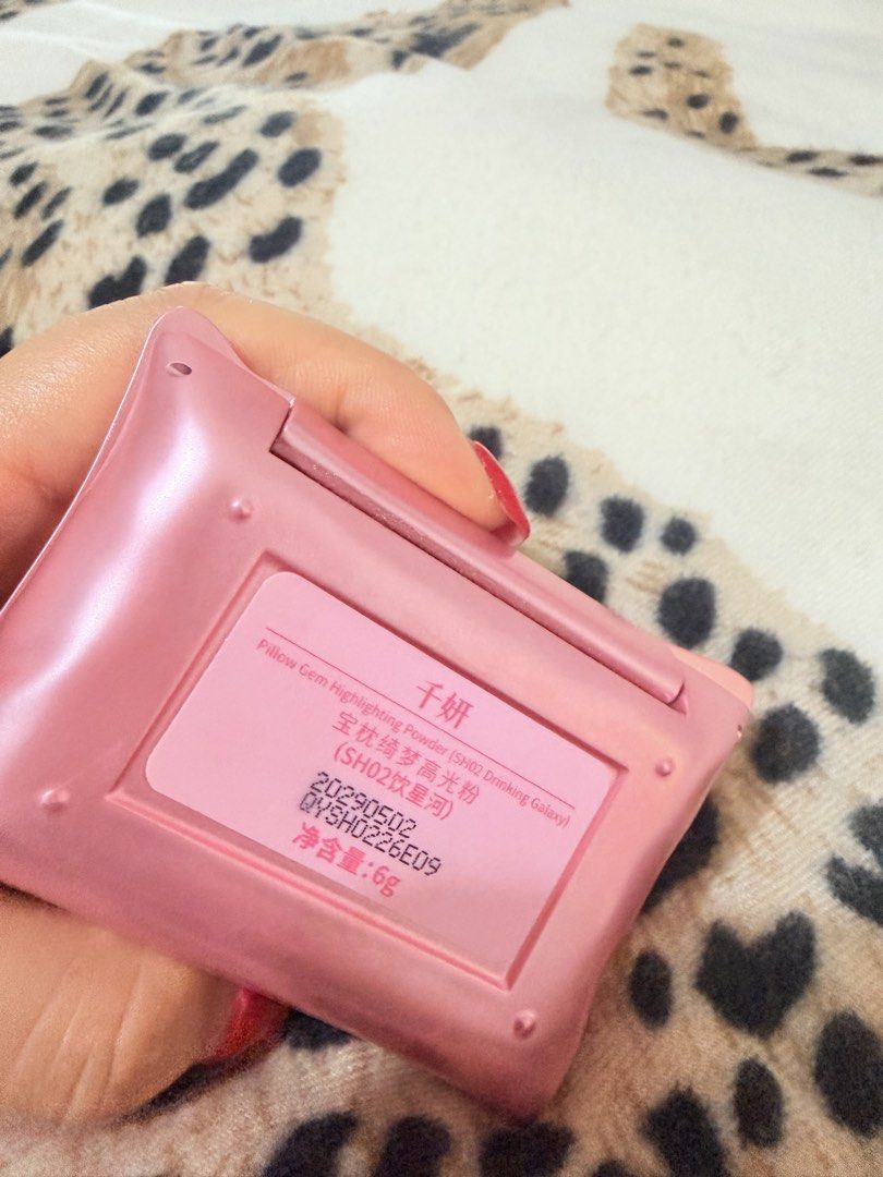 Cheeryep Pillow Gem Highlighting Powder Drinking Galaxy (Category: Makeup) located in Manila. Submitted by mengxir20193848 (Listing ID 1465879497, Image 2). Description: - Brand/Model: Cheeryep Highlighter Compact - Shade: SH02 Drinking Galaxy (6g) - Design: Pink pillow shape with a clear gem embedded on the front lid and a built-in mirror - Condition: Swatched once or twice, barely touched (like new) - Authenticity/Details: Back sticker clearly 