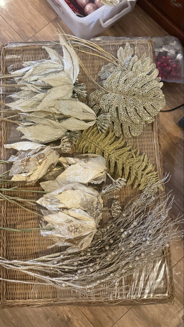 Christmas Tree Decorations Bulbs Flowers Leaves Set (Category: Artificial Plants & Flowers) located in Manila. Submitted by _purpleloved (Listing ID 1465882145, Image 1). Description: - Christmas tree decor bundle for a complete holiday setup - Includes silver and gold glitter leaves and floral picks - Features beaded branch sprays and festive red stars - Comes with hanging baubles in light pink, magenta, and silver - Packed in clear plastic boxe