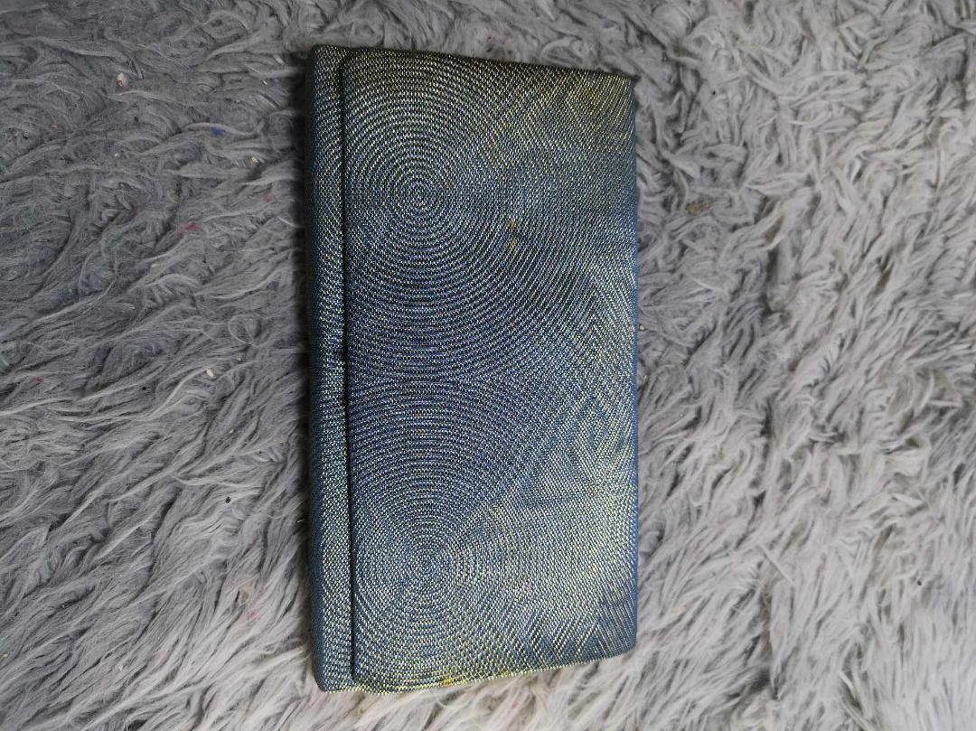 Circular Wave pattern Sleek Blue Clutch (Category: Clutches) located in Santa Cruz. Submitted by jmy_surplus.2 (Listing ID 1465883600, Image 3). Description: Size ; L - 5.3 W - 9 Color ; Blue Type ; Clutch Brand ; No brand Material ; Synthetic Style ; Sleek Blue Snap Closure Clutch LR 129 JMY 5 Batch #224.