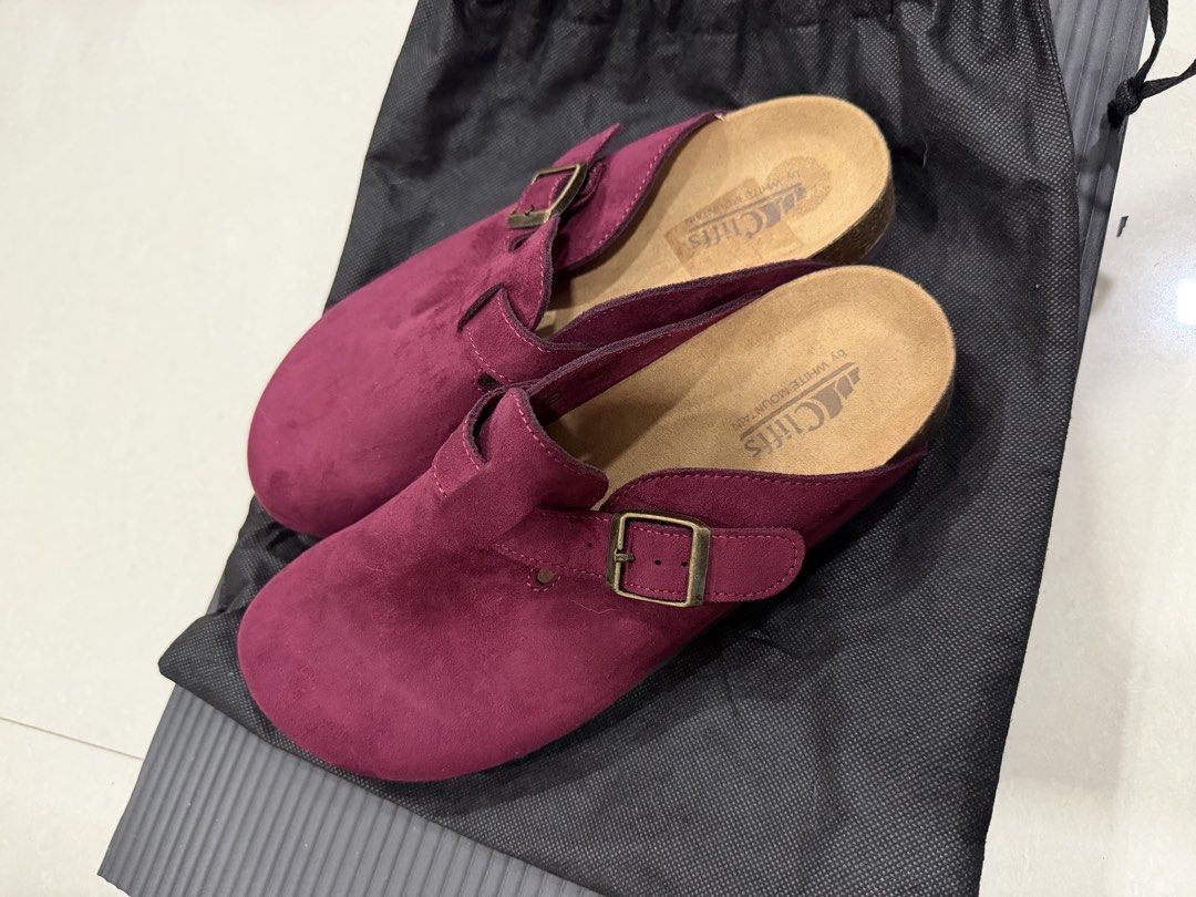 Cliffs by White Mountain Burgundy Suede Clogs Sandals (Category: Flats & Sandals) located in Manila. Submitted by imprincessg888 (Listing ID 1465863305, Image 2). Description: - Brand: Cliffs by White Mountain - Style: Slip-on clogs with adjustable bronze-tone buckle - Color / Material: Burgundy suede - Footbed: Comfortable cork with brand print - Condition: Excellent, clean uppers and soles with minimal wear - Inclusions: Comes with a black draw