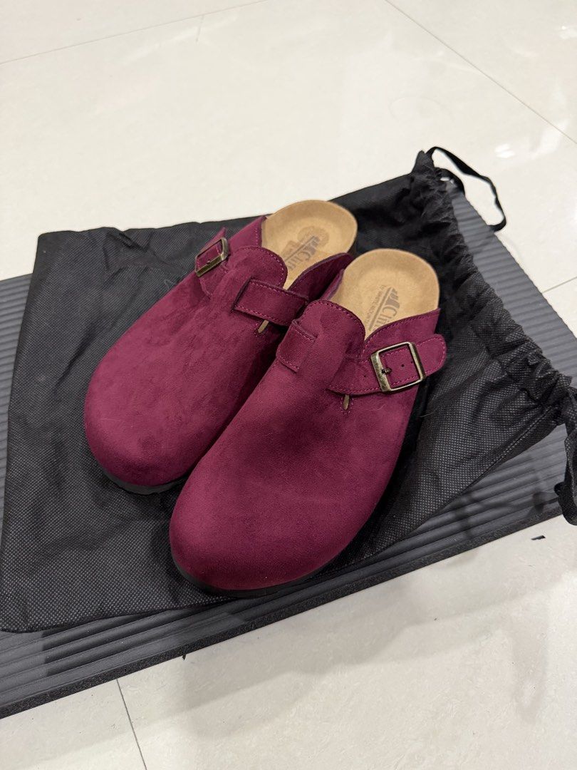 Cliffs by White Mountain Burgundy Suede Clogs Sandals (Category: Flats & Sandals) located in Manila. Submitted by imprincessg888 (Listing ID 1465863305, Image 1). Description: - Brand: Cliffs by White Mountain - Style: Slip-on clogs with adjustable bronze-tone buckle - Color / Material: Burgundy suede - Footbed: Comfortable cork with brand print - Condition: Excellent, clean uppers and soles with minimal wear - Inclusions: Comes with a black draw