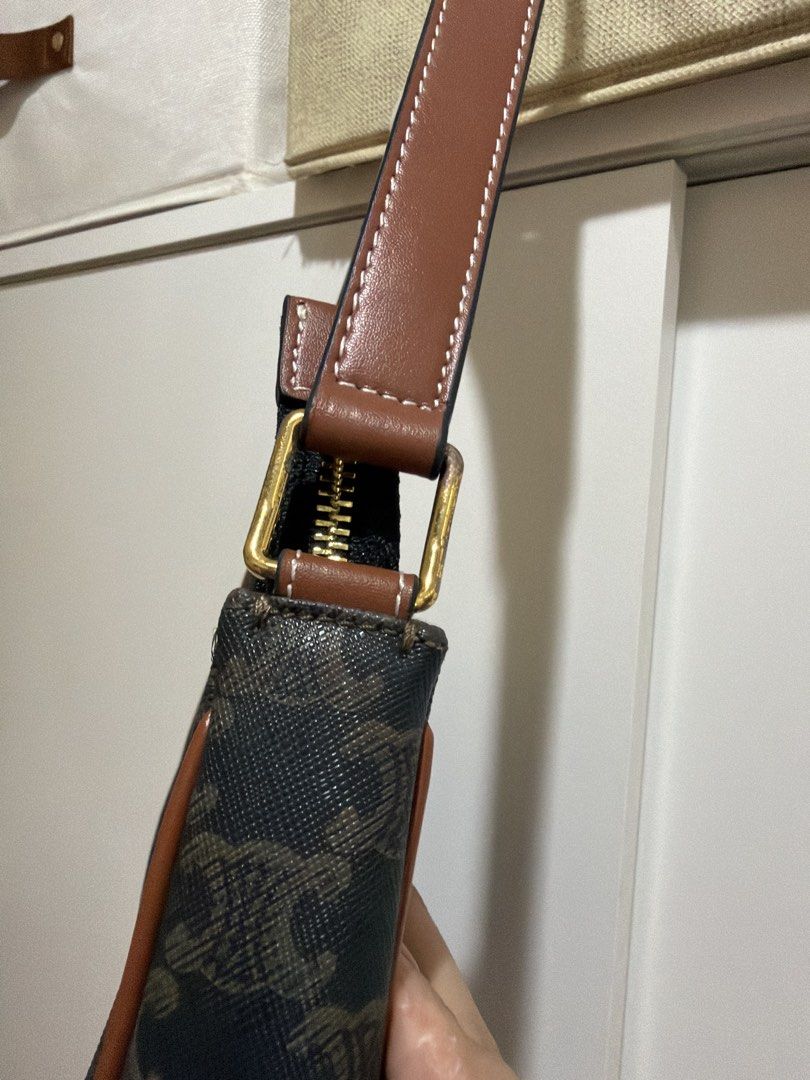 cln Triomphe Canvas Shoulder Bag (Category: Luxury Bags & Wallets) located in Binangonan. Submitted by thingsbymargs (Listing ID 1465860576, Image 3). Description: - cln triomphe shoulder bag in classic brown monogram canvas - Features premium tan leather trim and gold-tone hardware - Secure zip top closure with an adjustable leather strap - Clean interior lining with a practical size for daily essentials Price is negotiable Pm if interested .