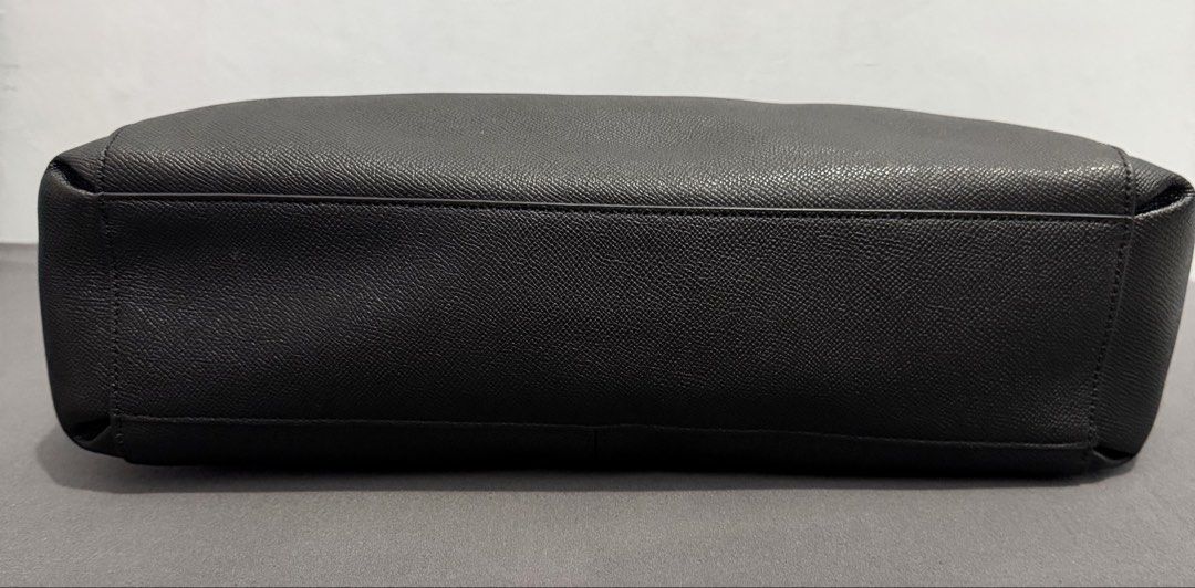 Coach Black Leather Large (Category: Luxury Bags & Wallets) located in Valenzuela. Submitted by mightgivesparkonyou (Listing ID 1465914690, Image 3). Description: - Authentic Coach bag in classic black pebbled leather - Elegant gold-tone hardware and secure top zip closure - Comfortable double shoulder straps with durable metal ring attachments - Spacious fabric-lined interior with great organization - Sturdy structure with a clean bottom base Ex