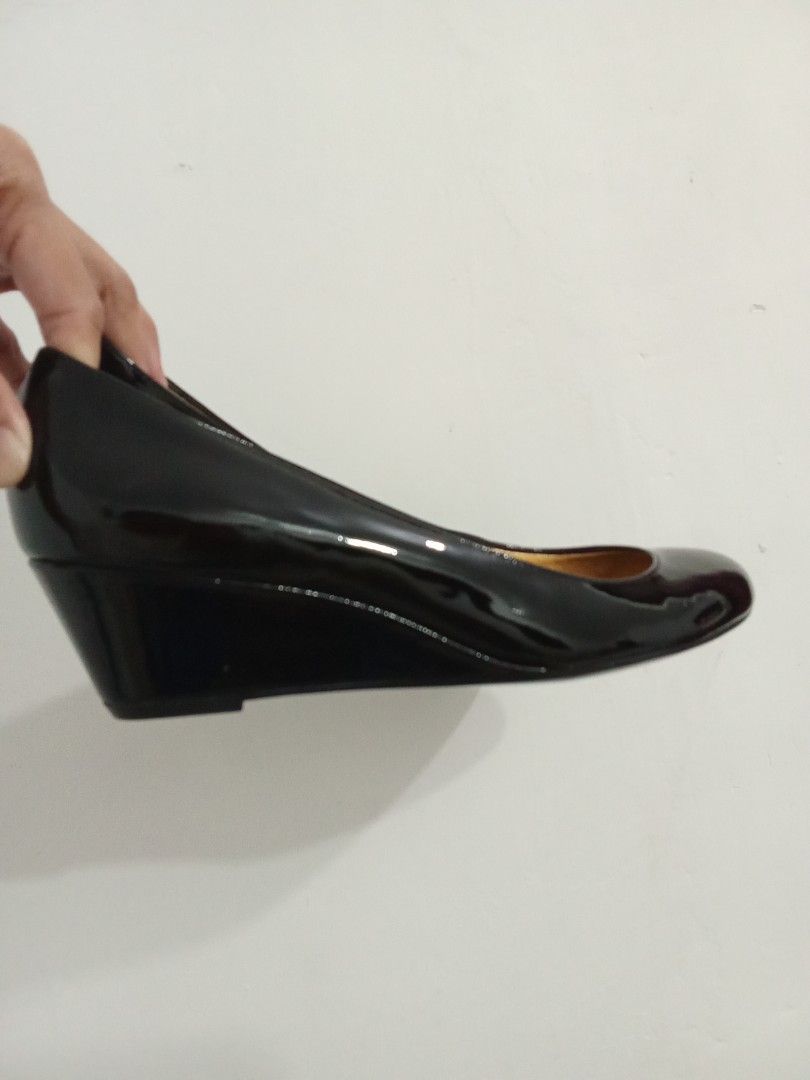 Coach black patent leather wedge heels (Category: Wedges) located in Quezon City. Submitted by jane019 (Listing ID 1465907391, Image 2). Description: - Brand: Coach - Style: Hidden wedge heels with round toe - Material: Clean black patent leather - Details: Luxurious gold inner lining with Coach stamped on footbed - Occasion: Ideal for work, corporate wear, or formal events - Condition: Well-maintained and ready to wear Actual Pics Posted Bought 