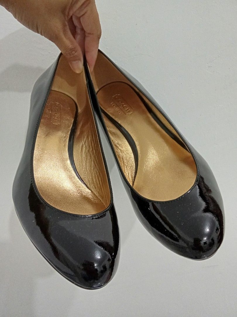 Coach black patent leather wedge heels (Category: Wedges) located in Quezon City. Submitted by jane019 (Listing ID 1465907391, Image 1). Description: - Brand: Coach - Style: Hidden wedge heels with round toe - Material: Clean black patent leather - Details: Luxurious gold inner lining with Coach stamped on footbed - Occasion: Ideal for work, corporate wear, or formal events - Condition: Well-maintained and ready to wear Actual Pics Posted Bought 
