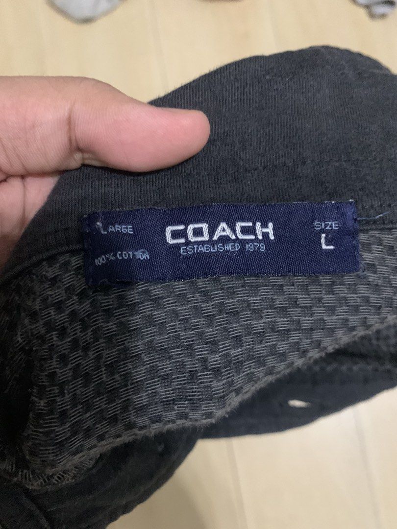 Coach Checked Polo Shirt Size L (Category: Tshirts & Polo Shirts ) located in Manila. Submitted by thrifty111 (Listing ID 1465924413, Image 2). Description: - Brand: Coach - Style: Checkered polo shirt - Color: Dark grey and black - Size: Large - Material: 100% breathable cotton - Features: Classic collar, single branded button placket, chest pocket, and ribbed cuffs/collar - Detail: Small embroidered Coach text logo on the left sleeve hem.