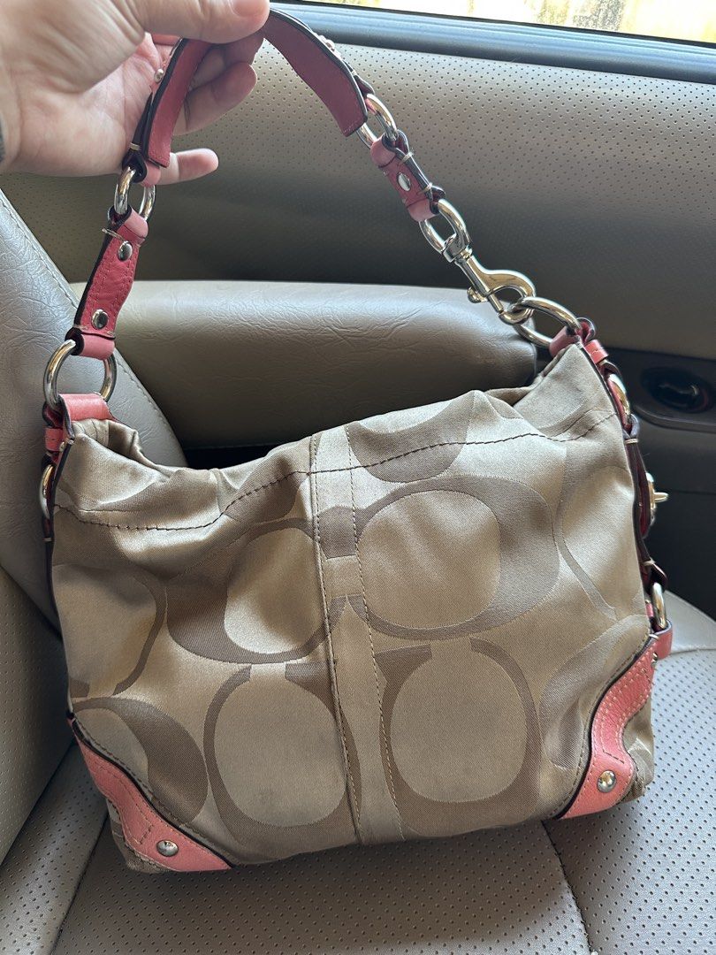 Coach Coral/Pink Carly Medium size (Category: Luxury Bags & Wallets) located in Manila. Submitted by glesylbd_22 (Listing ID 1465782918, Image 2). Description: -Needs wash -Minimal rubs on corners - Authentic Coach shoulder bag in beige signature C print - Stylish pink leather trim with silver-tone hardware - Dual chain and leather shoulder strap with iconic Coach hangtag - Structured base with metal protective feet rivets - Secure zippered top c