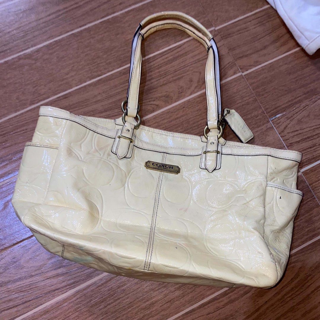 Coach embossed yellow patent leather bag (Category: Shoulder Bags) located in Paete. Submitted by fat.archives (Listing ID 1465850610, Image 1). Description: Working zipper but slightly hard Make up stains inside +sf 500 shipped.