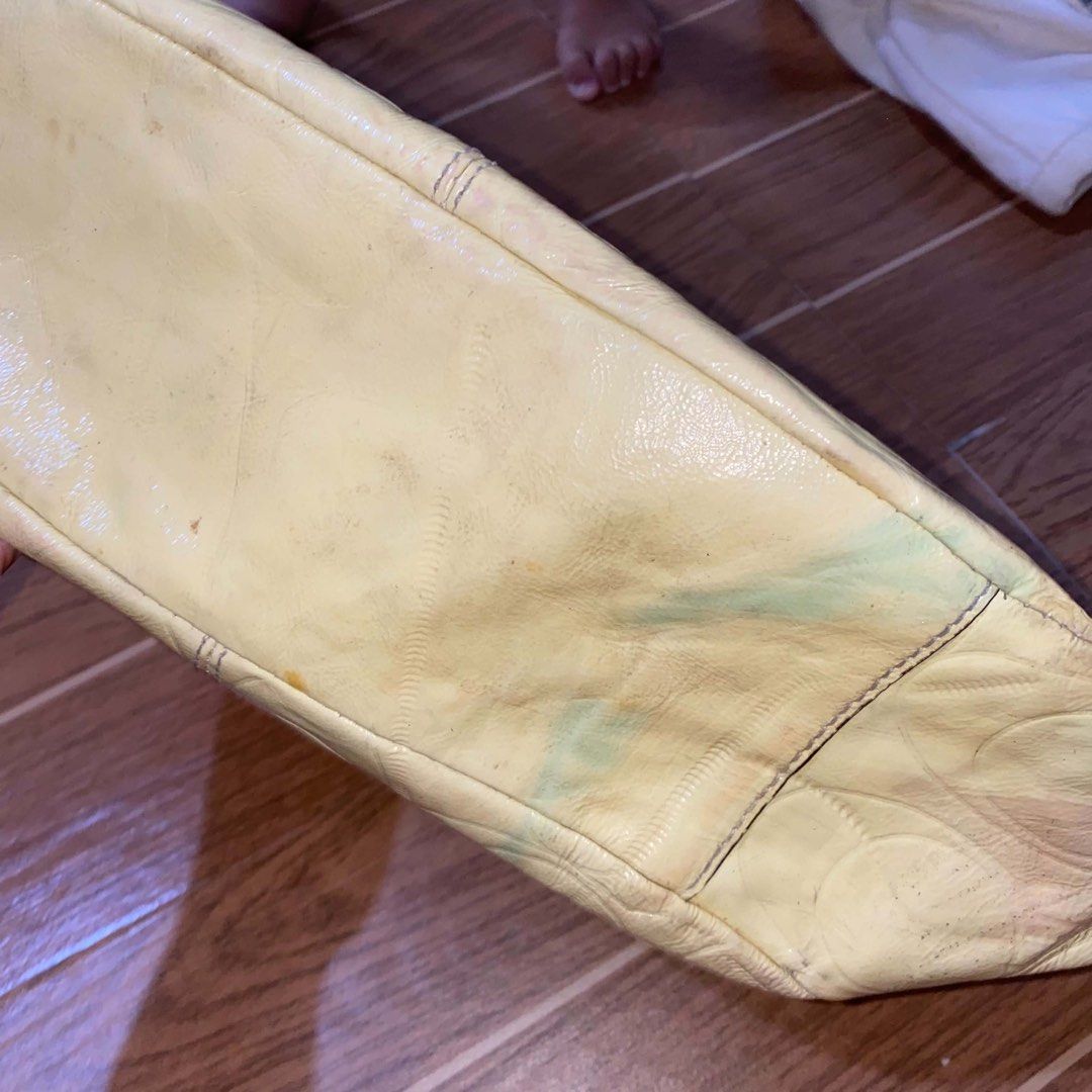 Coach embossed yellow patent leather bag (Category: Shoulder Bags) located in Paete. Submitted by fat.archives (Listing ID 1465850610, Image 3). Description: Working zipper but slightly hard Make up stains inside +sf 500 shipped.