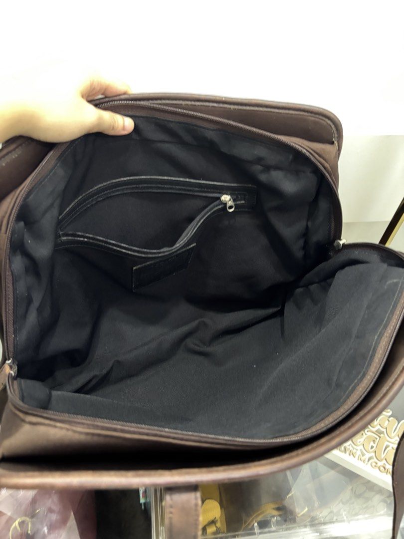 Coach Neoprene Chocobrown Tote (Category: Tote Bags) located in Cabanatuan. Submitted by cristalyngonzales (Listing ID 1465902057, Image 2). Description: Co ach Vintage Neoprene Chocobrown Tote bag 💯 2,300 Php flaws in the leather trimmings, pls see posted dets. still good for personal used 🥨.