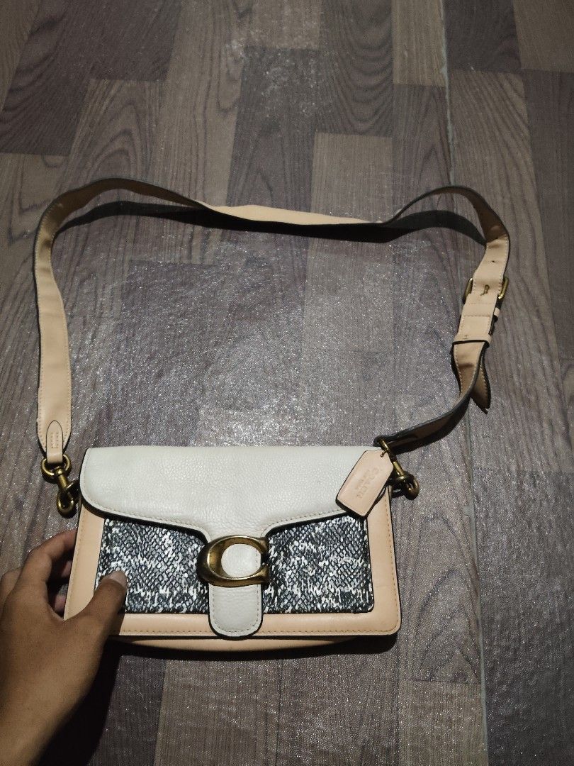 Coach Tabby Shoulder Bag Snake Print Tan White (Category: Luxury Bags & Wallets) located in Mamburao. Submitted by renzocutie (Listing ID 1465932602, Image 1). Description: off/legit -Coach shoulder bag in tan leather and black-and-white snake print texture - Eye-catching brass 'C' hardware on the front flap closure - Adjustable long strap with metal clasps for versatile wear - Comes with the original matching Coach leather hangtag - Luxurious mu