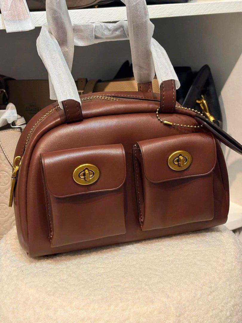 Coach Twin Turnlock in Maple (Category: Shoulder Bags) located in Quezon City. Submitted by bagsboutiqueph (Listing ID 1465786065, Image 1). Description: LAST PRICE POSTED. LIMITED STOCKS! BRANDNEW WITH INCLUSIONS. COLOR MAY SLIGHTLY VARY IN ACTUAL DUE TO LIGHTING AND CAMERA SETTING. OTHER PHOTOS WILL BE SEND DURING PURCHASE AND FOR SURE BUYERS ONLY. WHEN IN DOUBT, DO NOT ORDER. THANK YOU..