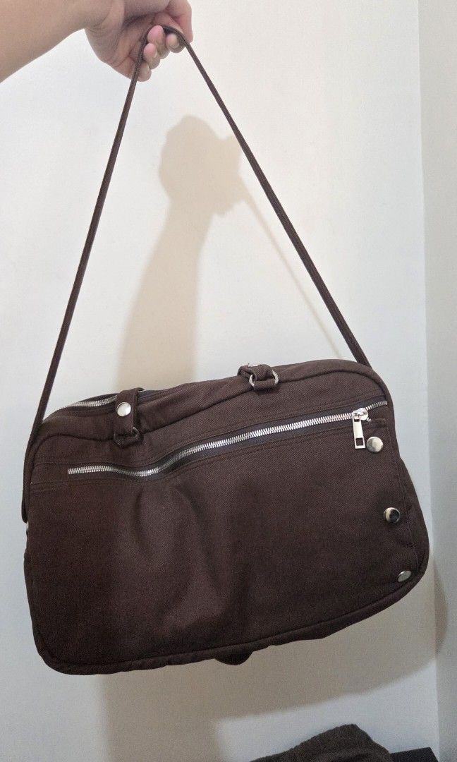 Cocoa Bowler Bag with Detachable Straps (Category: Shoulder Bags) located in Manila. Submitted by es.corner (Listing ID 1431288643, Image 2). Description: •Decluttering •Used only twice •Bowler Bag with dust bag •Cocoa color •Two-way zipper •Front zipper flap with three snap buttons •Detachable straps and extra shoulder strap •Fits 13-14 inch laptops Payment - Bank Transfer/Gcash SDD.