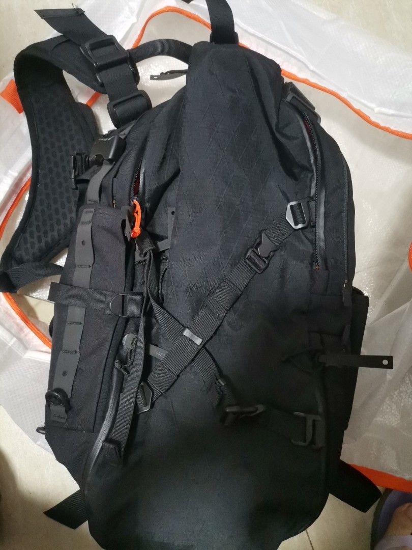 CodeOfBell X-Type Backpack Black Orange (Category: Backpacks) located in Makati City. Submitted by kookybearsstuff (Listing ID 1465827462, Image 1). Description: - Brand: CodeOfBell - Color: Black exterior with vibrant orange interior lining - Laptop Storage: Padded internal compartment with secure velcro strap - Organization: Multiple internal pockets for everyday carry items - Gear Attachment: Lots of external webbing, compression straps, and q