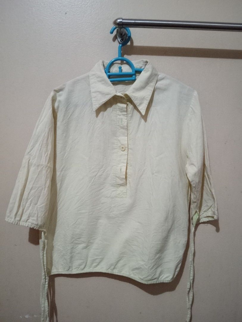 Collared Half-Sleeve Top with Drawstrings (Category: Blouses) located in Makati City. Submitted by YSL80022 (Listing ID 1465903352, Image 1). Description: - Color: Light green - Style: Relaxed-fit blouse with classic shirt collar and half sleeves - Details: Partial front button placket and adjustable drawstrings on cuffs and hem - Material: Lightweight linen breathable fabric - Perfect for: Casual days out, easily paired with high-waisted denim o
