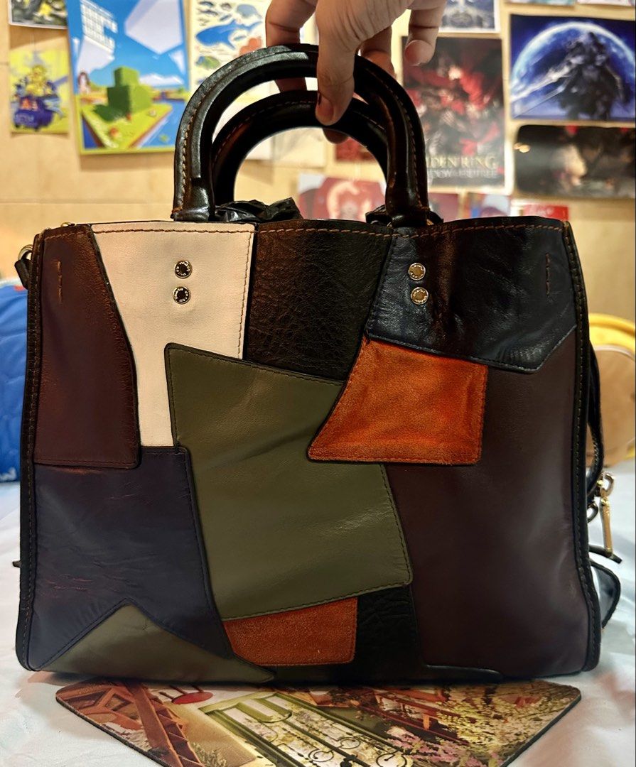 [Authentic] Coach 30 Rogue Patchwork Bag (Category: Luxury Bags & Wallets) located in Talisay. Submitted by kuyav (Listing ID 1465857056, Image 3). Description: ‼️ AUTHENTIC This is the 2016 Runway collection Coach 30 Rogue Patchwork bag <Inclusions> ~ Original Hangtag ~ Original Locket ~ Original leather Straps • Outside is glovetanned leather with bits of suede, pebbled leather and distressed leather • Lining on the inside is suede and in the m